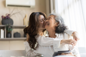Portrait of enjoy happy love asian family senior mature mother and young daughter smiling play...