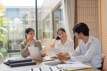 Business Team Collaborating on Work Plans During a Meeting in a Modern Office Setting