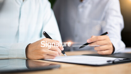 Fototapeta premium Business Agreements and Approvals ,business contract signing ,Confirmation of contract documents or warranty card ,legal contract ,guarantee correctness ,Signing a form ,Business paperwork