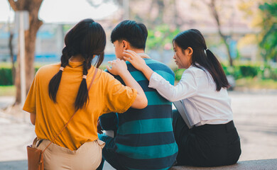 Fellow students are consoling friends who are disappointed in grades, frustrated with tasks that are not meeting their goals, helping each other.