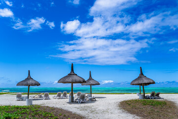 A stunning view of a pristine beach in Ile Aux Cerfs, Mauritius. The turquoise waters, soft white sand, and swaying palm trees create a perfect tropical paradise.