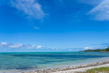 Visitors experience the thrill of paragliding in the beautiful lagoon of Ile Aux Cerfs, Mauritius. Visitors can glide effortlessly on the calm waters, surrounded by stunning scenery.