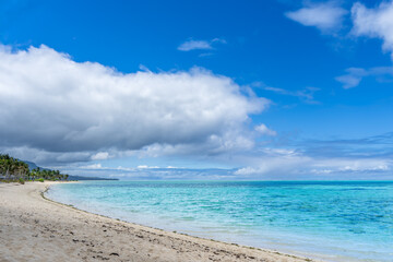 Visitors experience the thrill of paragliding in the beautiful lagoon of Ile Aux Cerfs, Mauritius. Visitors can glide effortlessly on the calm waters, surrounded by stunning scenery.