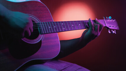 Guitar concert. Song performance. Man musician artist hands playing chords on acoustic string...