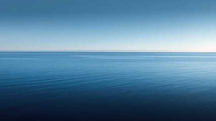 Obraz premium Calm Ocean with Smooth Blue Hues at Sunset