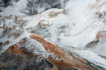 Steam hot springs and snow scene in Noboribetsu Hell Valley, Hokkaido, Japan