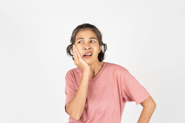 A woman experiencing a toothache, holding her jaw with a pained expression, set against a white...