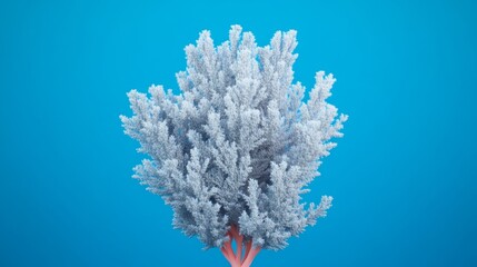 Naklejka premium A white, stylized tree against a bright blue background.