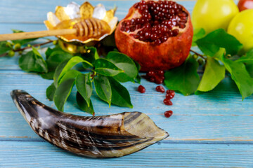 Shofar, pomegranates, apples and honey are traditional symbols of Rosh Hashanah.