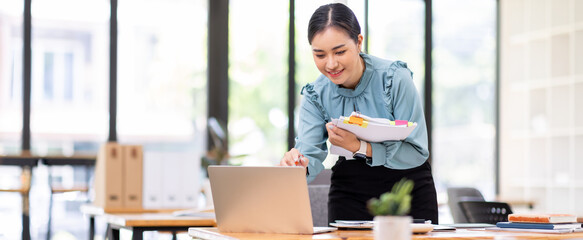 asian business woman or auditor examining documents,Professional scrutinizes financial documents...