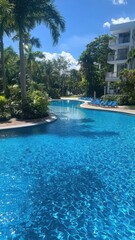 Luxurious swimming pool featuring refreshing water and a sleek, modern ambiance, perfect for relaxation and leisure.