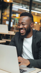 Happy Young Professional Working at Cafe