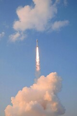 Rocket Launch Amidst Clouds and Blue Sky Majestic Technology in Action