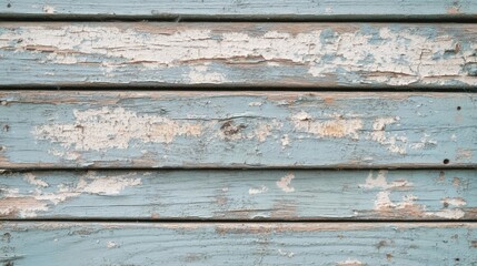 Obraz premium Closeup of weathered, peeling paint on blue wood planks