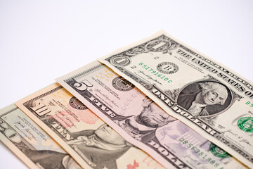 Four different colored United States of America dollar bills