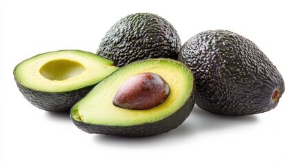 A close up of a black avocado with the seed still inside