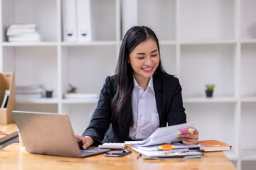 Business asian woman Reviewing Documents, business woman's hands meticulously reviewing a stack of documents, highlighting the details and precision of her work. 
