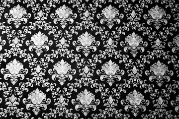 A black and white floral patterned wallpaper