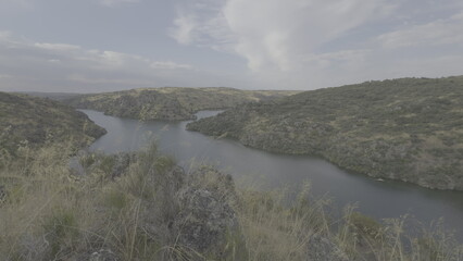 Scenic view of Esla and Duero rivers merging with rocky cliffs