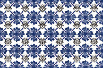 Ikat is abstract ethnic art with a seamless pattern in tribal, folk embroidery, and Mexican style. It is an Aztec geometric art ornament print designed for carpets, wallpaper, fabric, and clothing.