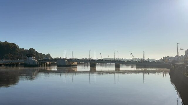 Vehicle traffic on Rice Bridge, a lift bridge crossing Suir River, IRL