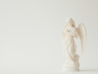 Elegant white angel statue against minimalist light background