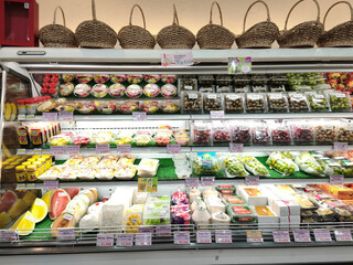 A display of fresh fruits and vegetables in a supermarket near Surabaya.
