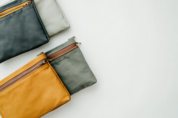 Set of travel pouches with zippers on a white surface