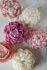 Handmade wax candle in the shape of a pink peony flower