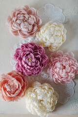 Handmade wax candle in the shape of a pink peony flower