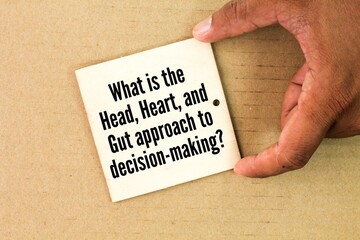 wood with the question What is the Head, Heart, and Gut approach to decision-making?