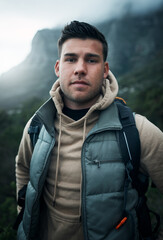 Hiking, health and portrait with man on mountain for explore, travel and adventure. Challenge, wellness and camping holiday with person and trekking in nature for backpacking, fitness and vacation