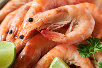 Boiled shrimps with lime and parsley, closeup