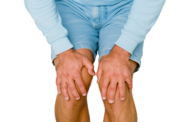 Man is standing and holding his knees, experiencing pain, transparent background. knee pain.
