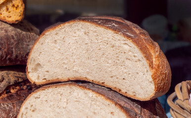 A slice of bread is cut in half, revealing the inside of the loaf