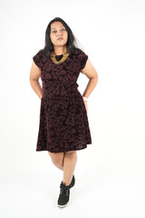 flexible female model in mannequin standing pose front off camera, fashion concept , brown velvet dress , full body , short sleeve , knee length dress, isolated over white background.