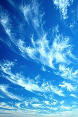 White Cirrus Clouds Streaking Across a Blue Sky