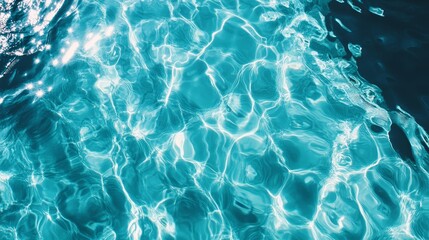 Obraz premium Abstract Blue Water Texture Background Ripples and Reflections in Swimming Pool Summer V