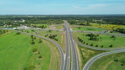 Highway passing through forest from above