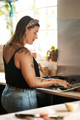 Girl, reading or tablet in kitchen for cooking, recipe tutorial or streaming lesson online. Woman,...