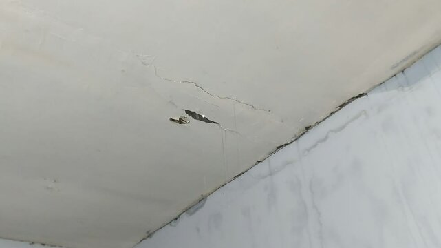 water flowing from a leaking ceiling