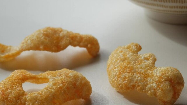 Crisps figures with spooky shapes, bats and ghosts. Snack on Halloween celebration.