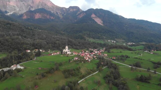 drone view of Dreznica village in Kobarid municipality, Slovenia, aerial fly away