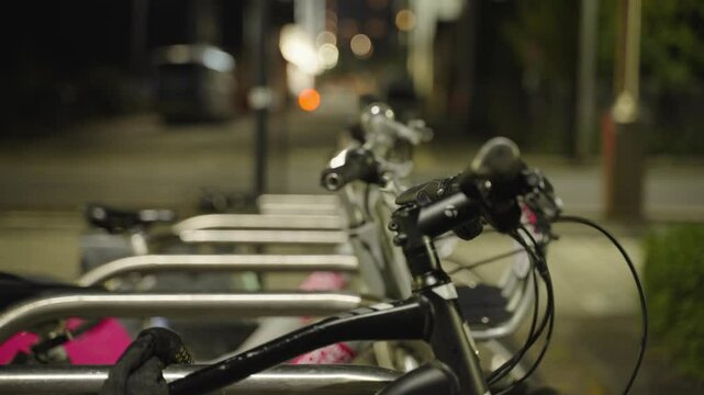 Bikes lined up in a tidy row, waiting for rental riders with places to go