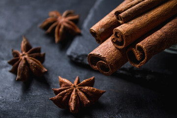 Cinnamon and star anise on a dark background. Spicy spices