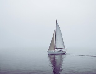 A perfect name for this image could be: Sailboats on Waterways in Summer, Sailing Across Sea,  and Lake Under the Sunny Sky