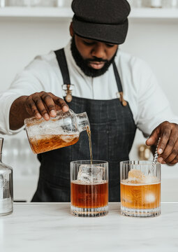 Bartending class in progress, instructor showing how to layer cocktails