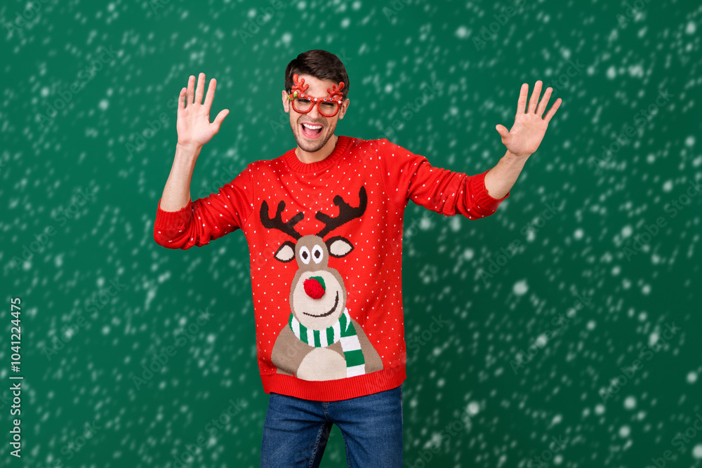 Poster portrait of attractive cheerful guy dancing fooling having fun winter day isolated over green color 