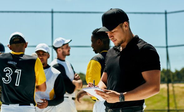 Men, baseball coach and writing with team for game plan, strategy or roster in match, tournament or competition. Young, group or players with trainer or referee taking notes of formation on pitch