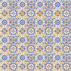 Yellow-blue geometric tiled wall. Different glazed Tiles